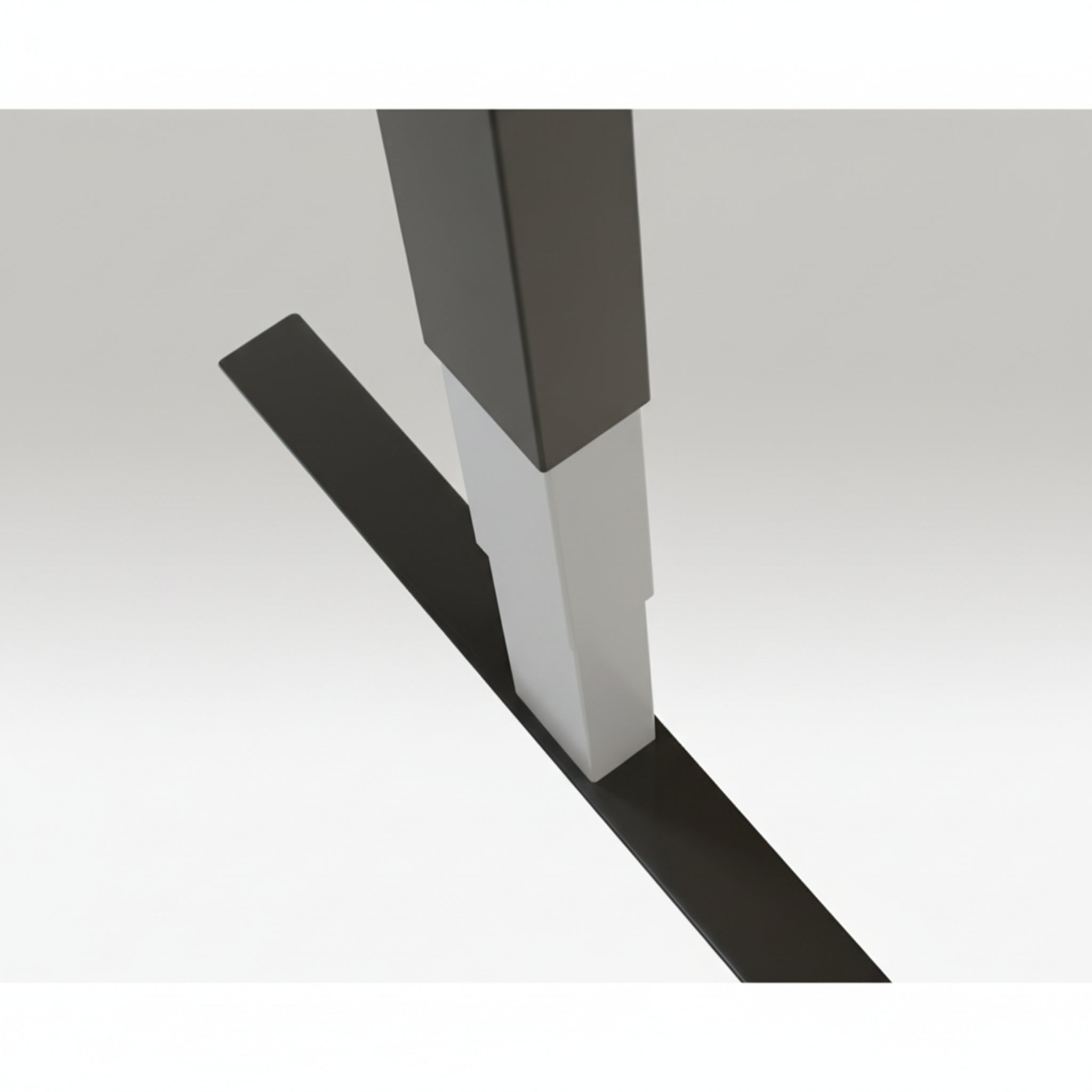 Close-up of Quiet Motor Standing Desk dark grey frame showing top leg join and metallic finish detail
