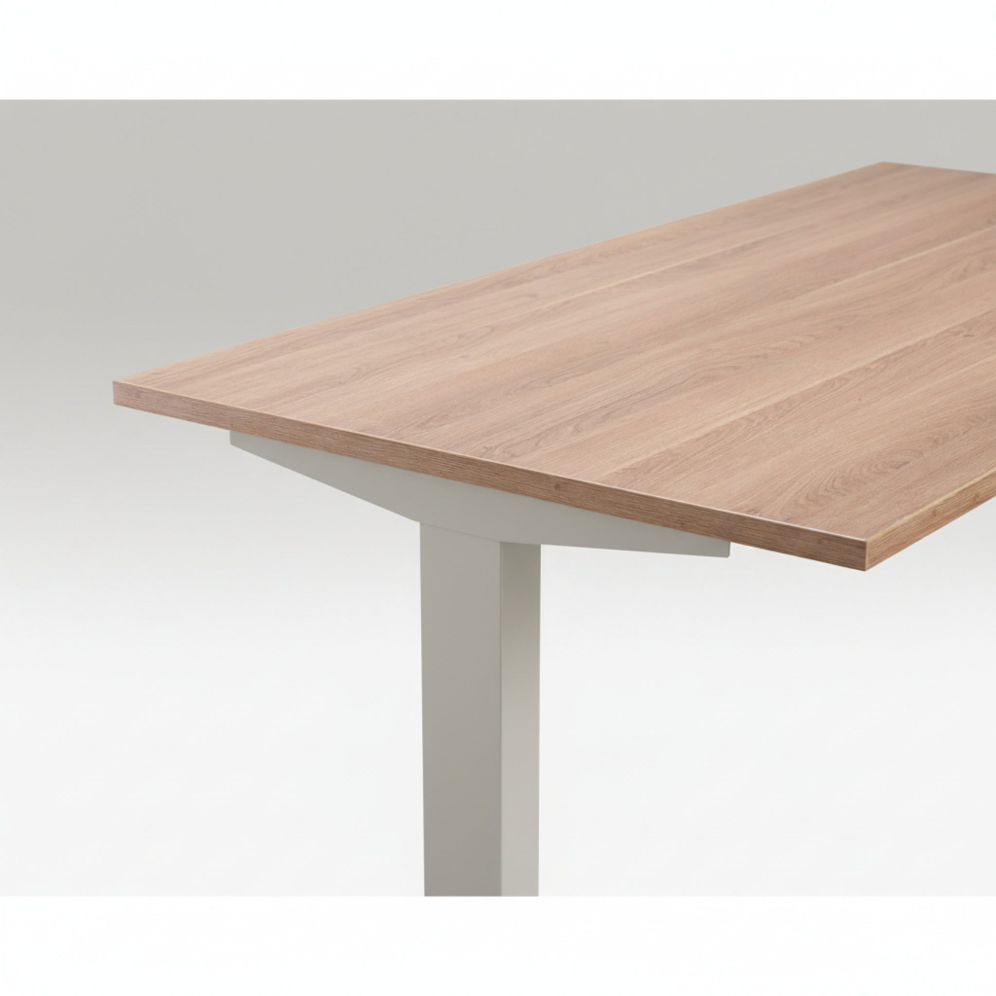 Close-up of Quiet Motor Standing Desk with wooden desktop and light grey metal leg