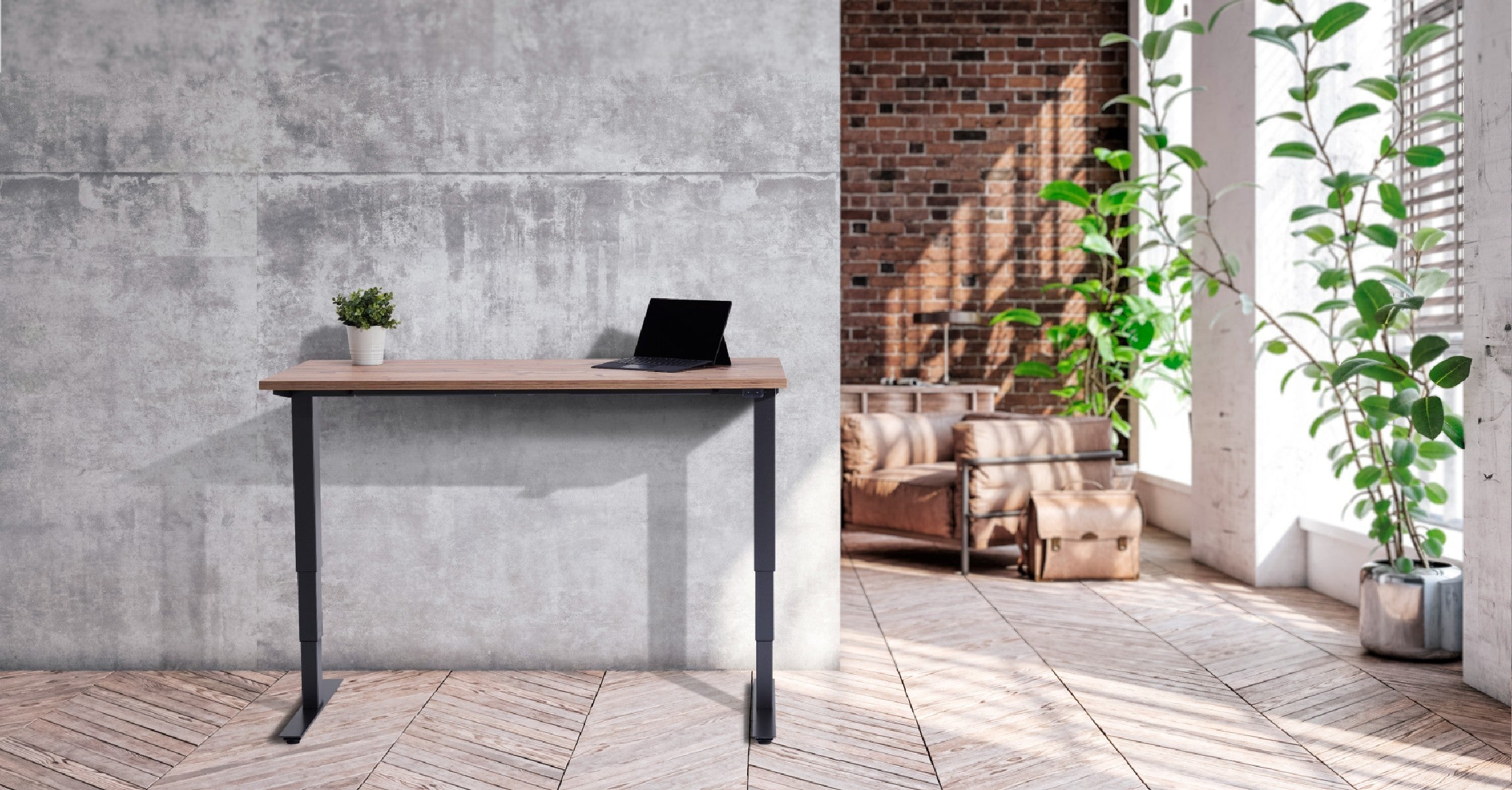 UrbanErgo standing desk in a modern flat with concrete walls, natural light, and greenery