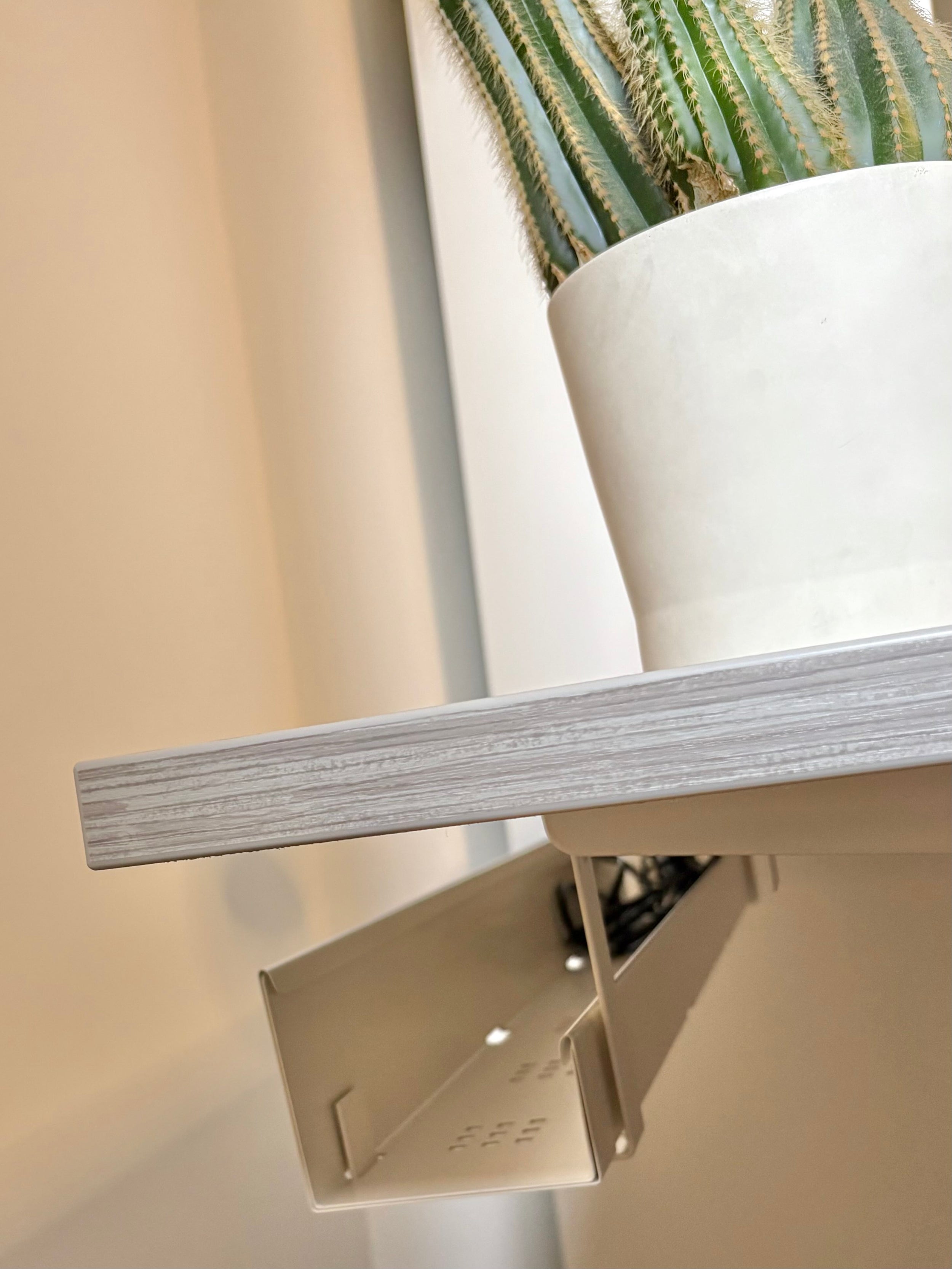Under-desk cable tray installed on the UrbanErgo Core standing desk for clean cable management