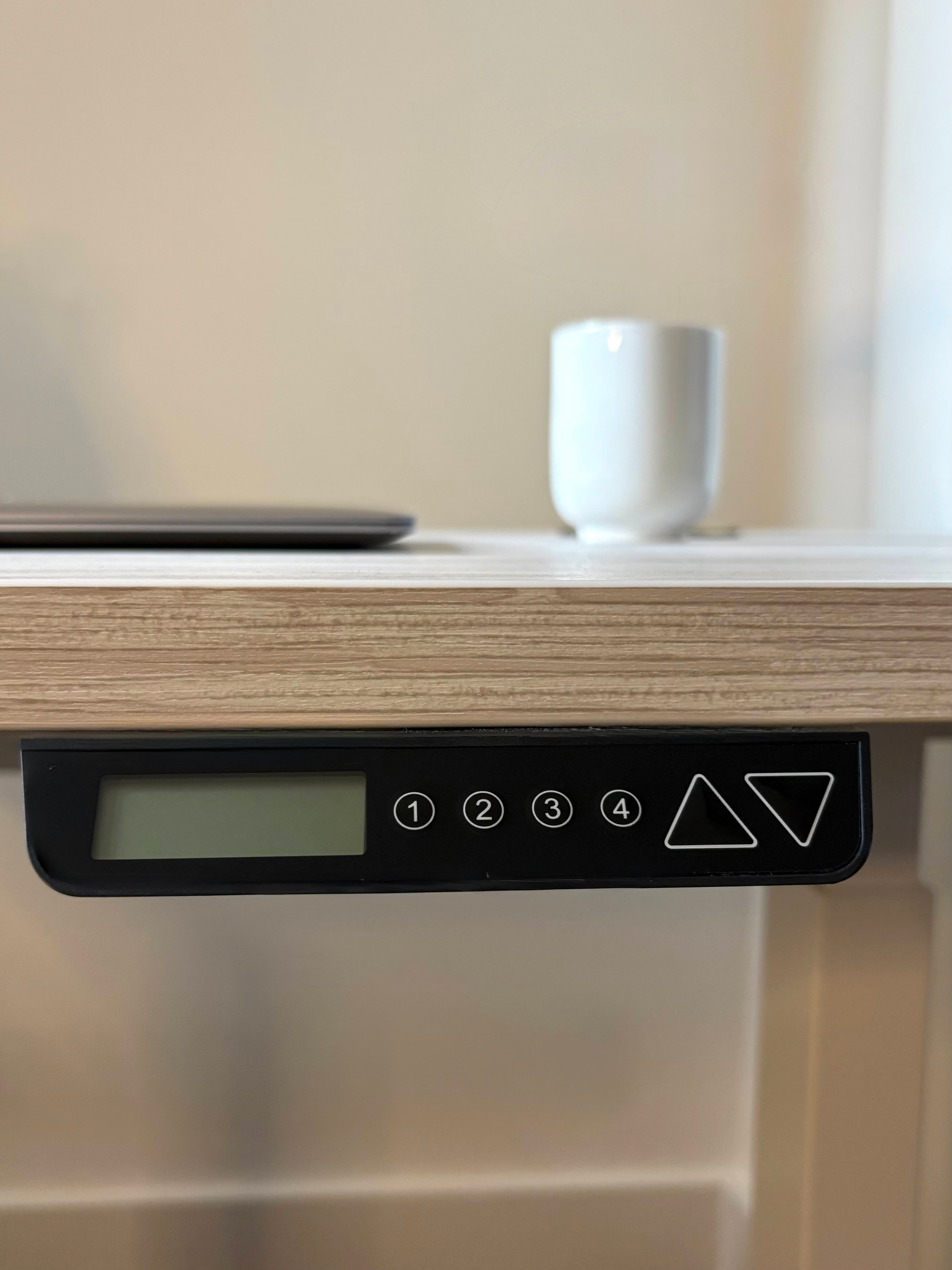 Close-up of the control panel on the UrbanErgo Core electric standing desk