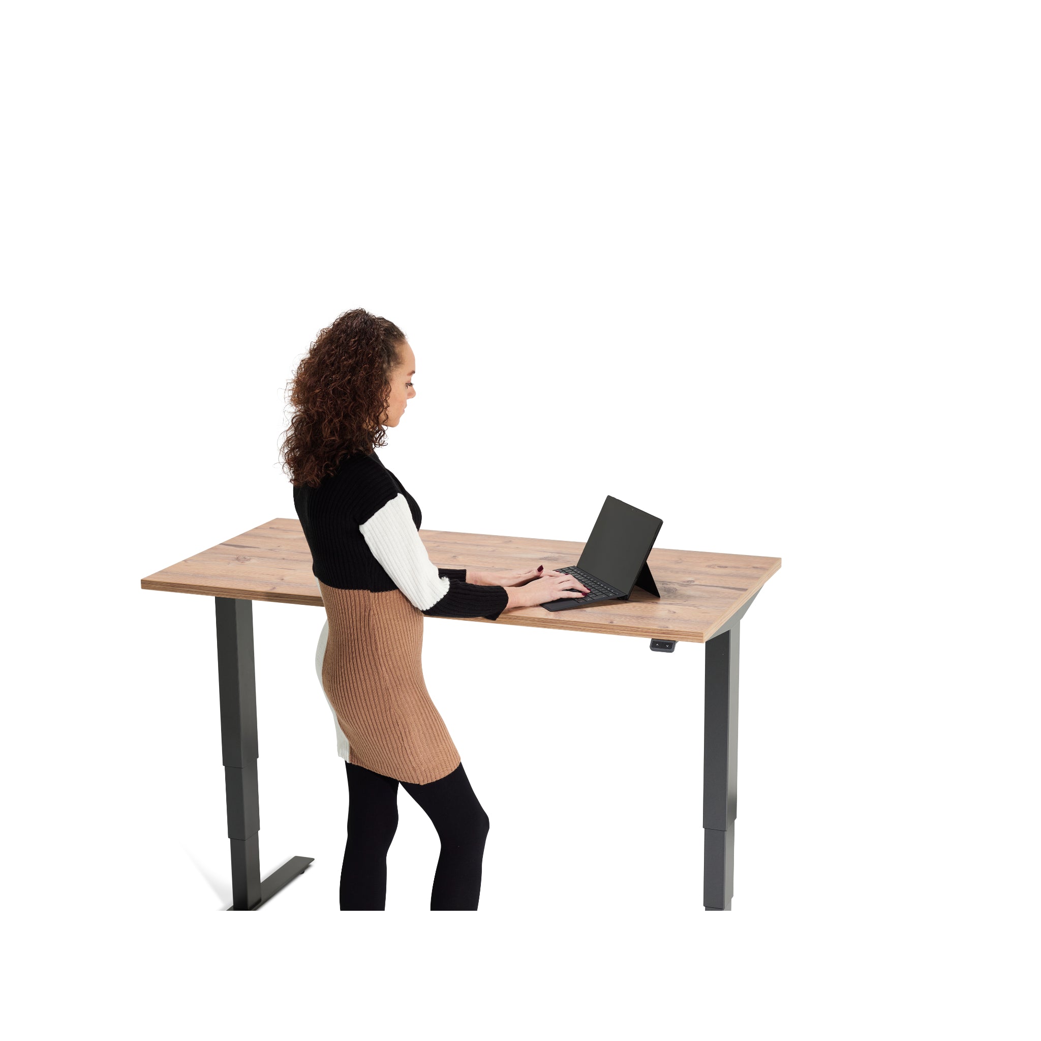 UrbanErgo Signature sit-stand desk used in a clean minimalist workspace